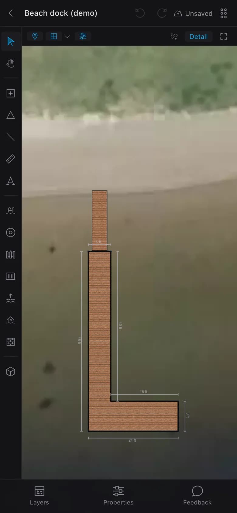 The free designer on a phone, signed out: an L-shaped dock and gangway drawn to scale on an aerial photo of a beach, with the tool rail down the left and Layers, Properties and Feedback along the bottom.